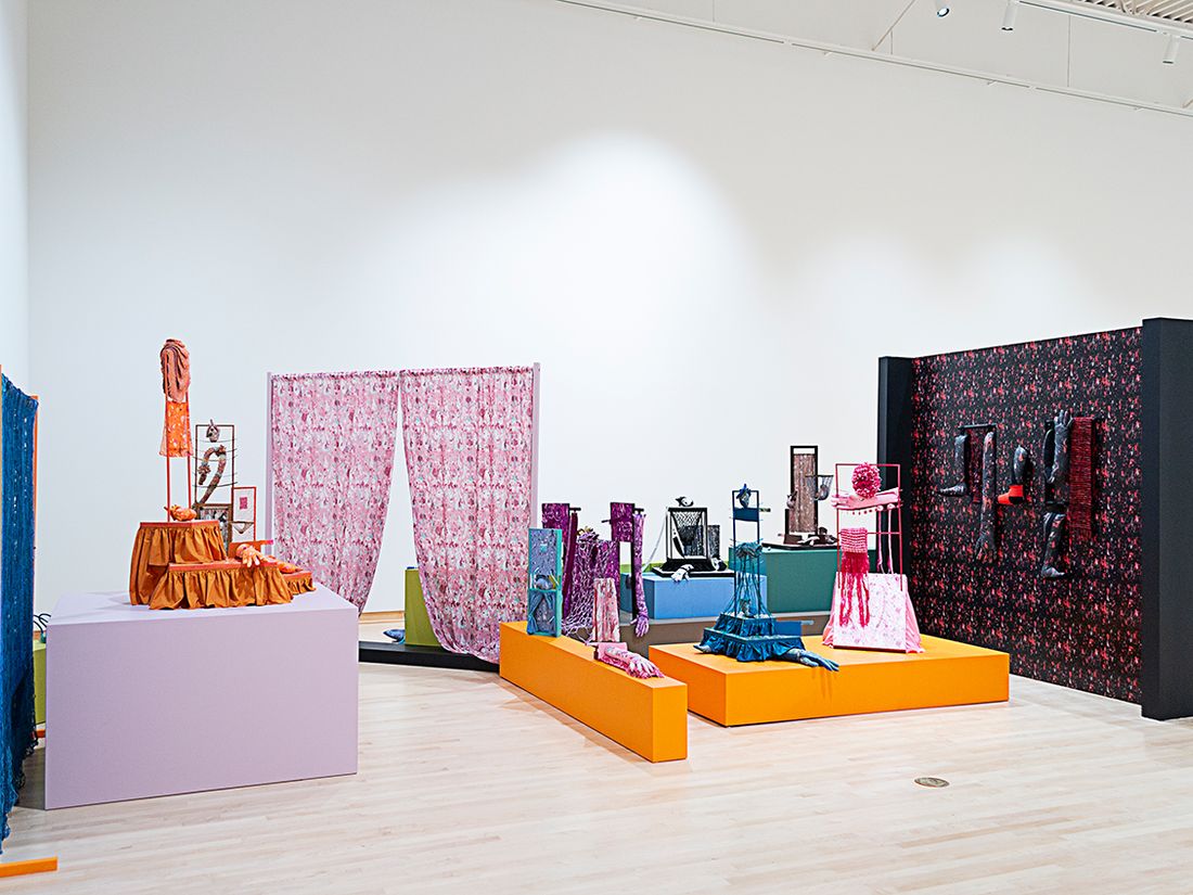 Installation view of a group show, titled High Touch, curated by Kaytie Johnson at John Michael Kohler Arts Center, Sheboygan, Wisconsin, USA. The installation is based on a typical 1960s ranch house façade, which is flattened and then used as a floorplan for plinths and walls for the 17 sculptures to inhabit. The foundation for each sculpture is a constructed and dyed wooden frame dressed with different fiber techniques, such as weaving (using an 8-shaft floor loom), dyeing, repeat pattern printing on cotton and wallpaper, coiling, tufting, embroidery, crocheting, knitting, netting, and sewing by hand and machine.