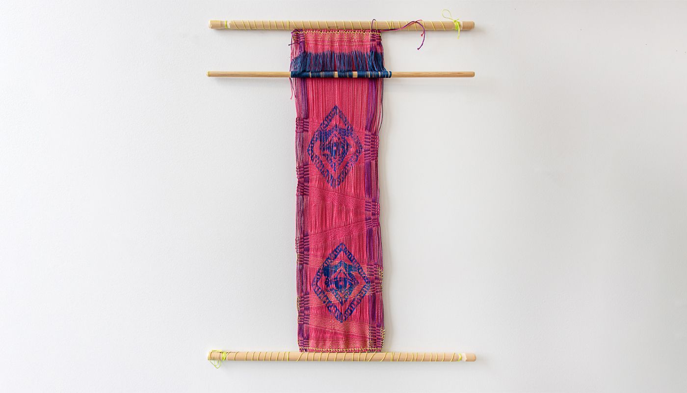 Backtrap weaving with the warp silkscreened with an image.