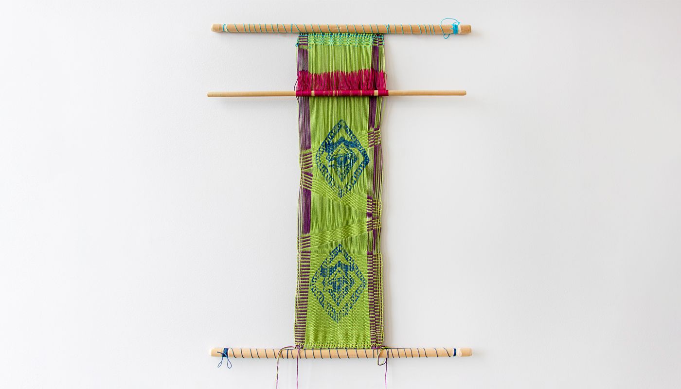 Backtrap weaving with the warp silkscreened with an image.