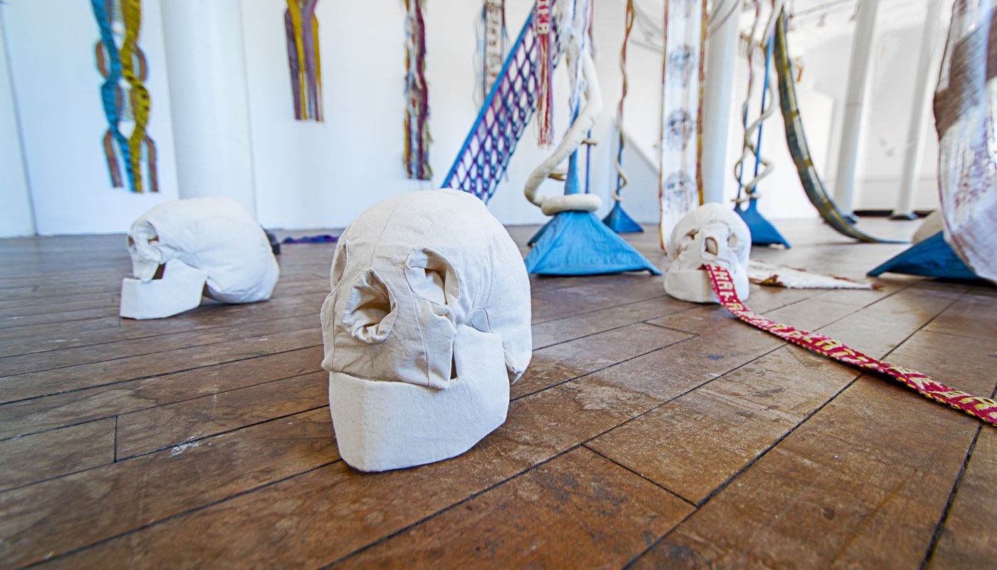 Detail shots of soft sculpture skulls.